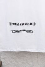 White long-sleeve T-shirt with ornamental ribbon-style text print on the front