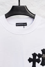White crewneck long-sleeve T-shirt with partial black cross print at the hem