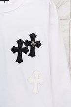 White long-sleeve T-shirt with three black cross appliques and a light cross below