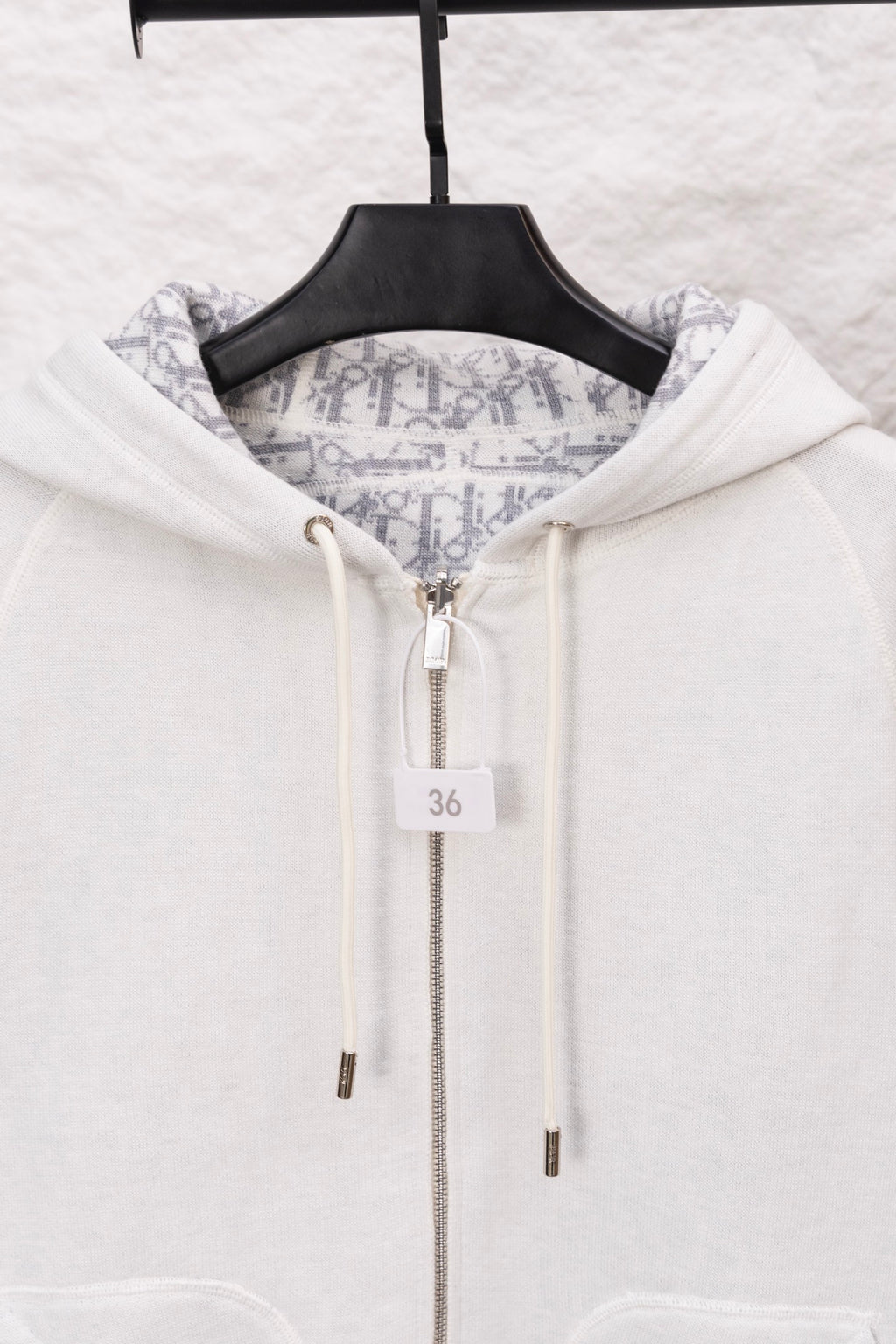 Dior logo-print hoodie with white hood, central zipper and size 36 tag