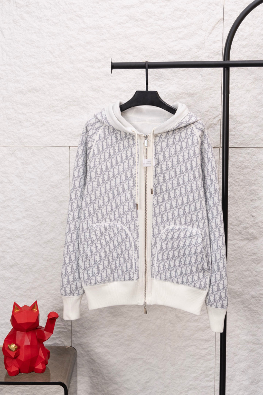 Dior monogram zip hoodie front, white hood and sleeves with patterned knit