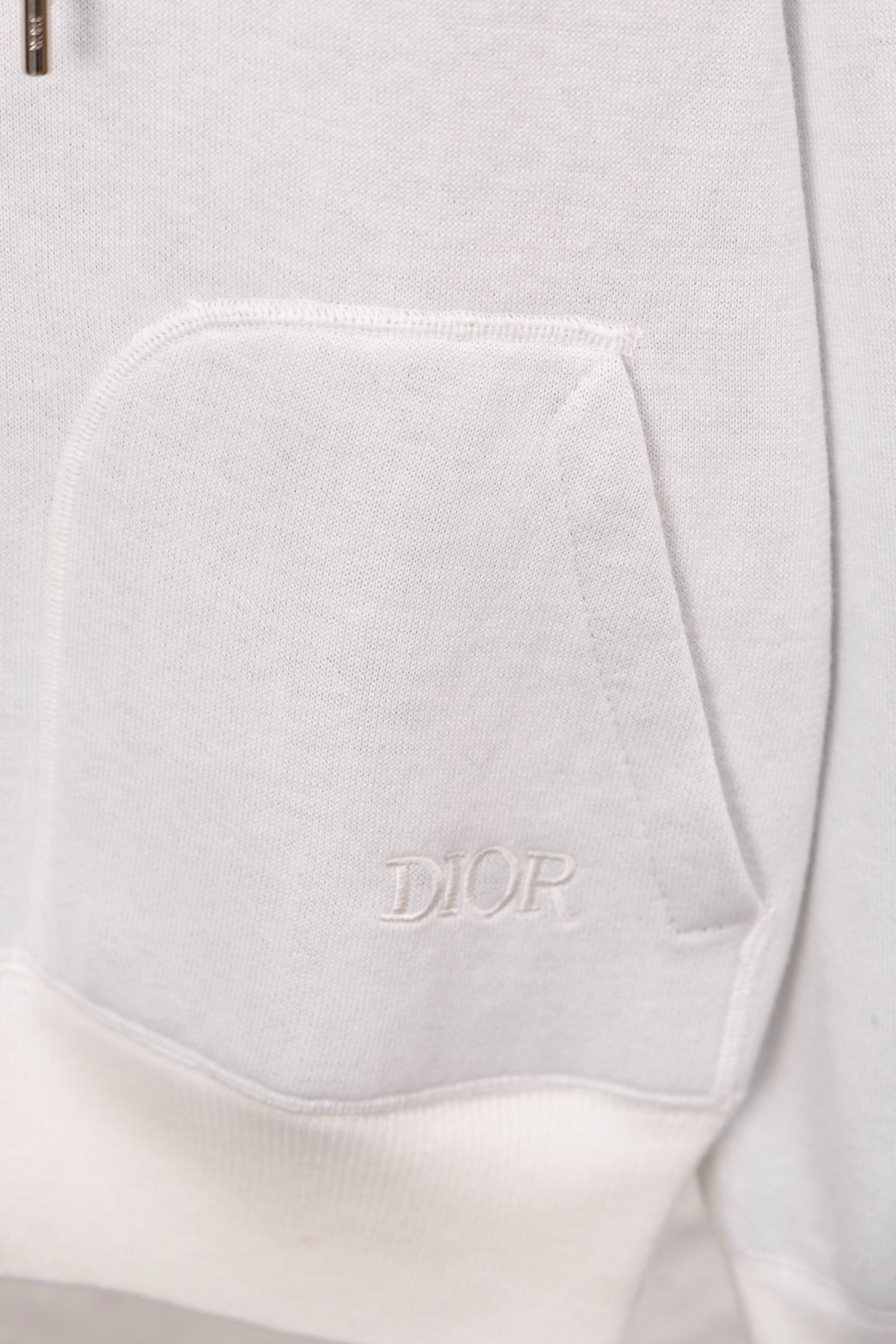 Dior monogram zip hoodie hem detail, white hood lining with DIOR print