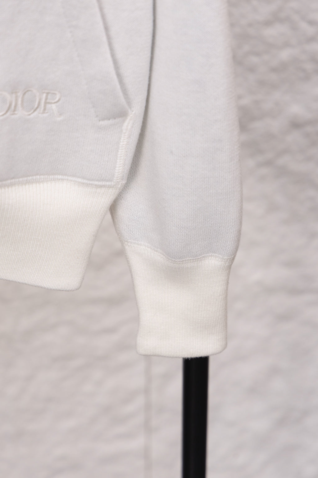Dior monogram zip hoodie lower sleeve detail, white ribbed cuffs and hem