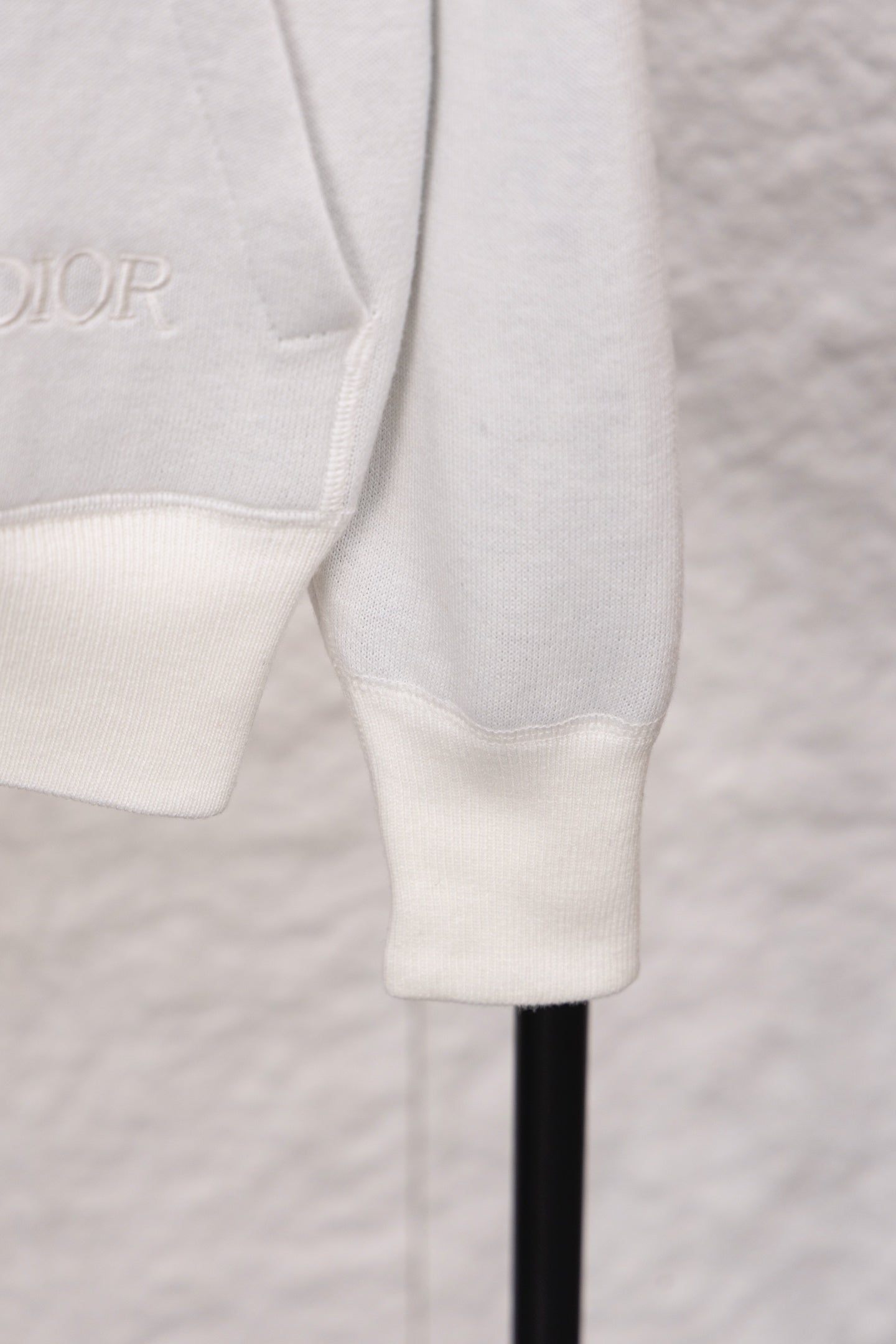 Dior monogram zip hoodie lower sleeve detail, white ribbed cuffs and hem