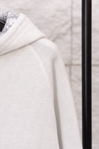 Dior hoodie sleeve in textured white knit with stitched seam