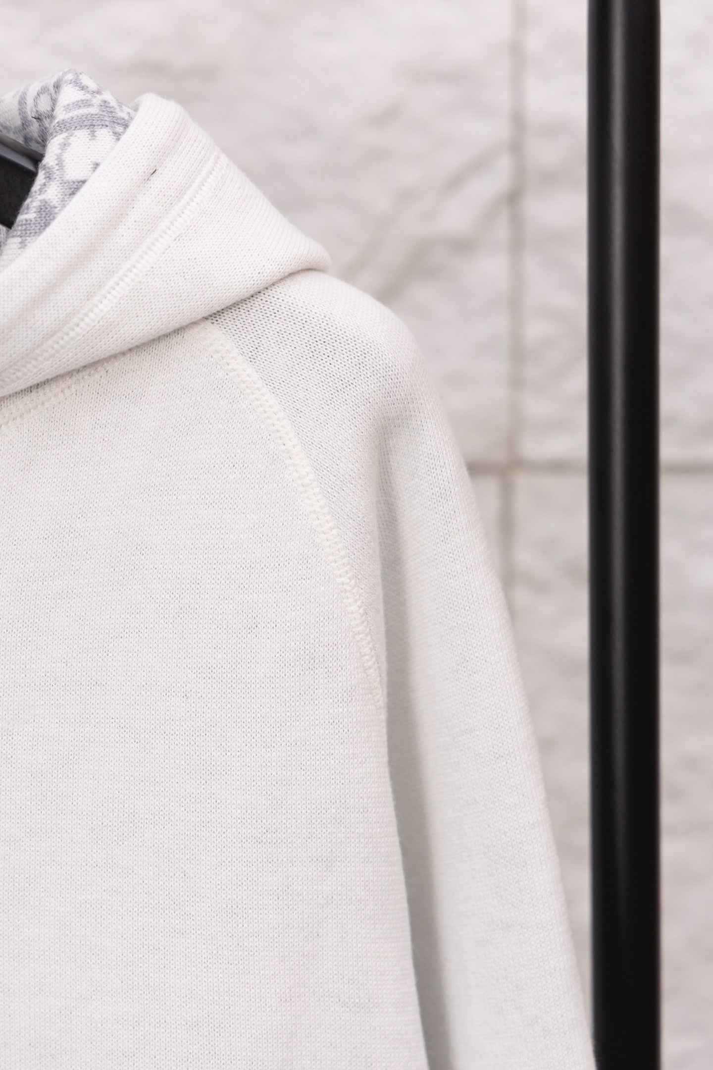 Dior hoodie sleeve in textured white knit with stitched seam