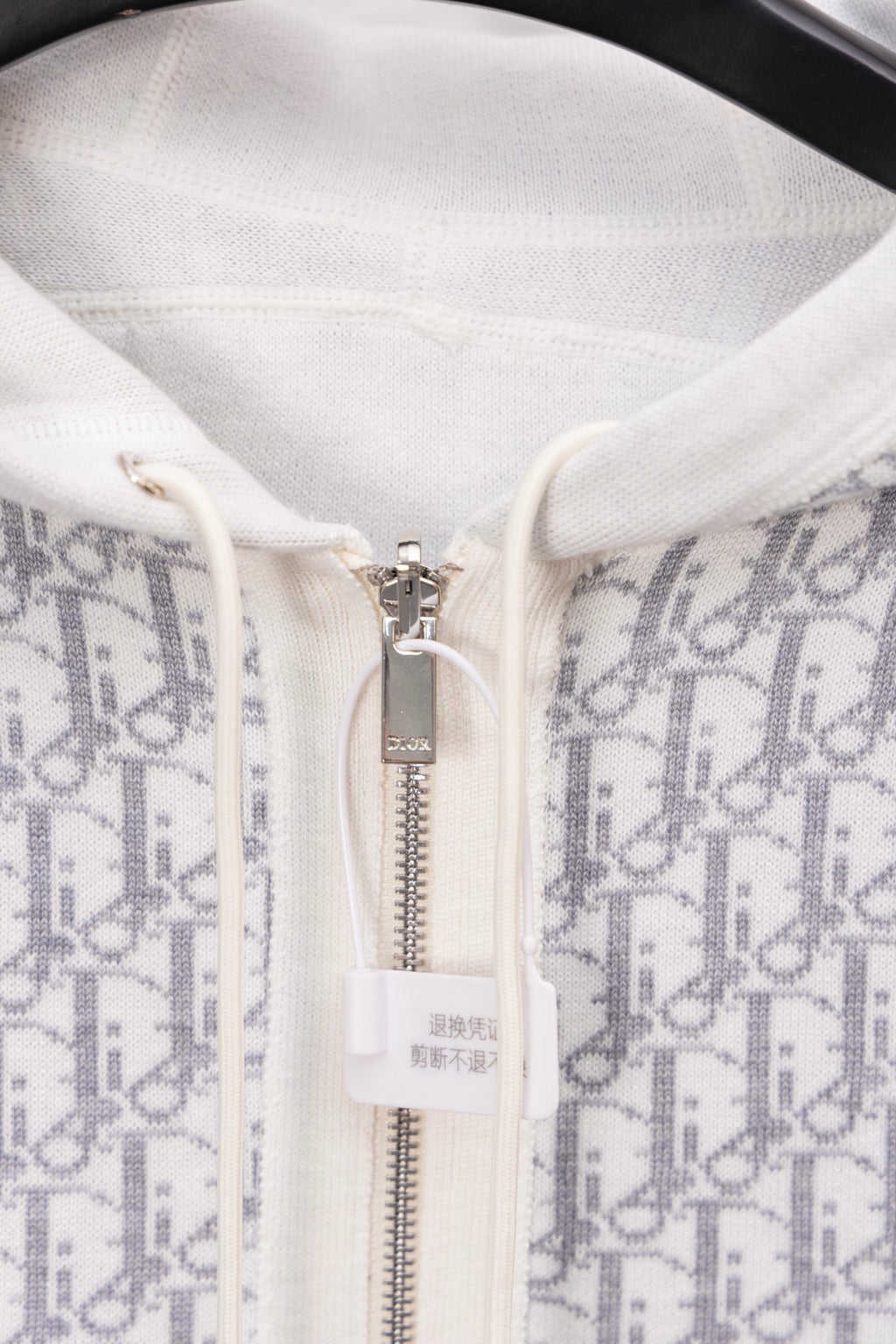 Dior monogram zip hoodie close-up, metal zipper and drawstring area
