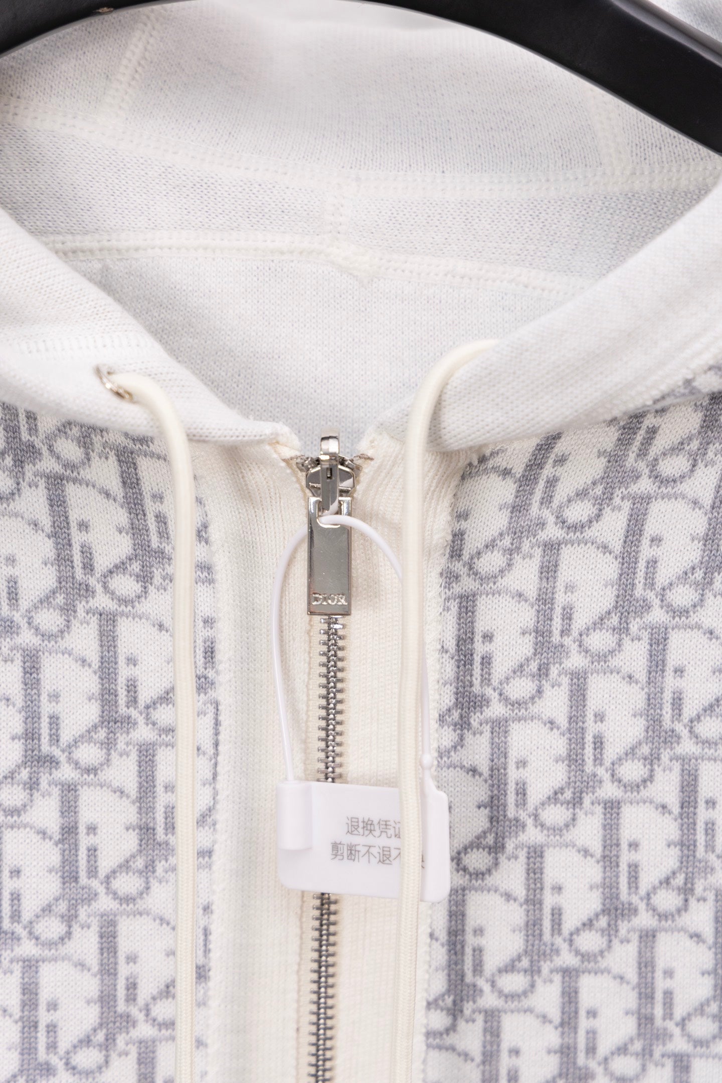 Dior monogram zip hoodie close-up, metal zipper and drawstring area