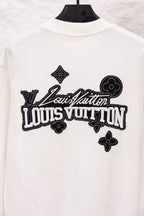 White sweatshirt with oversized Louis Vuitton logo graphic across the back
