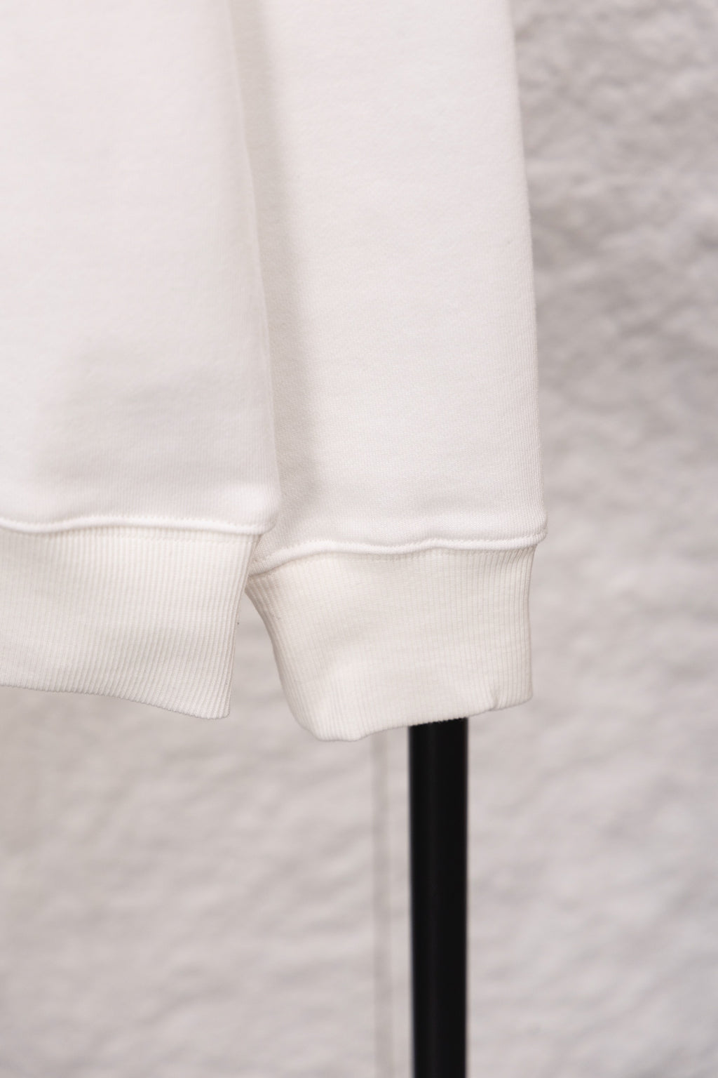 White sweatshirt cuff and hem with ribbed knit trim