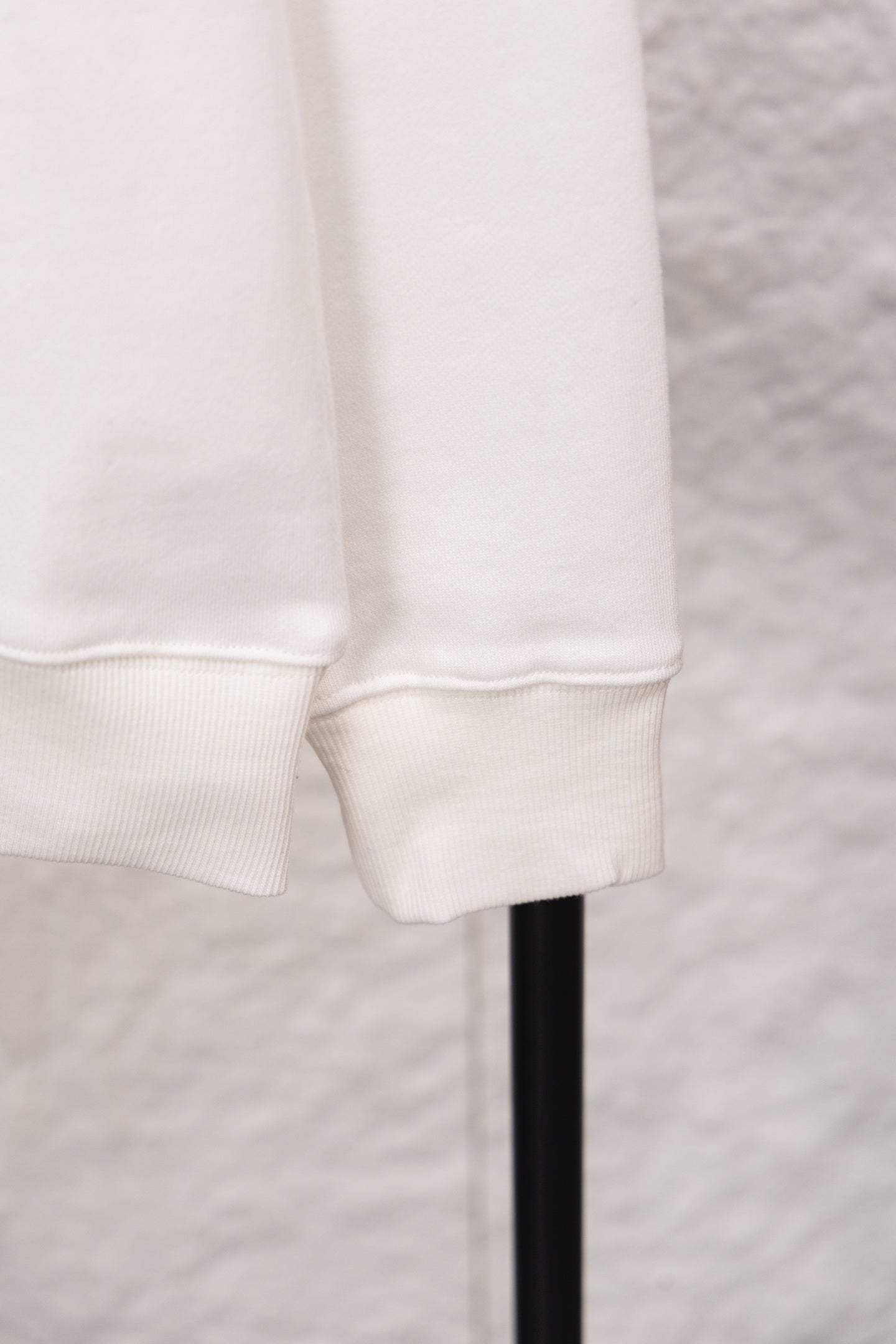 White sweatshirt cuff and hem with ribbed knit trim