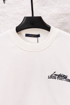 White sweatshirt neckline with small Louis Vuitton logo on the side