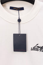 White sweatshirt neckline with blue Louis Vuitton tag and inner label