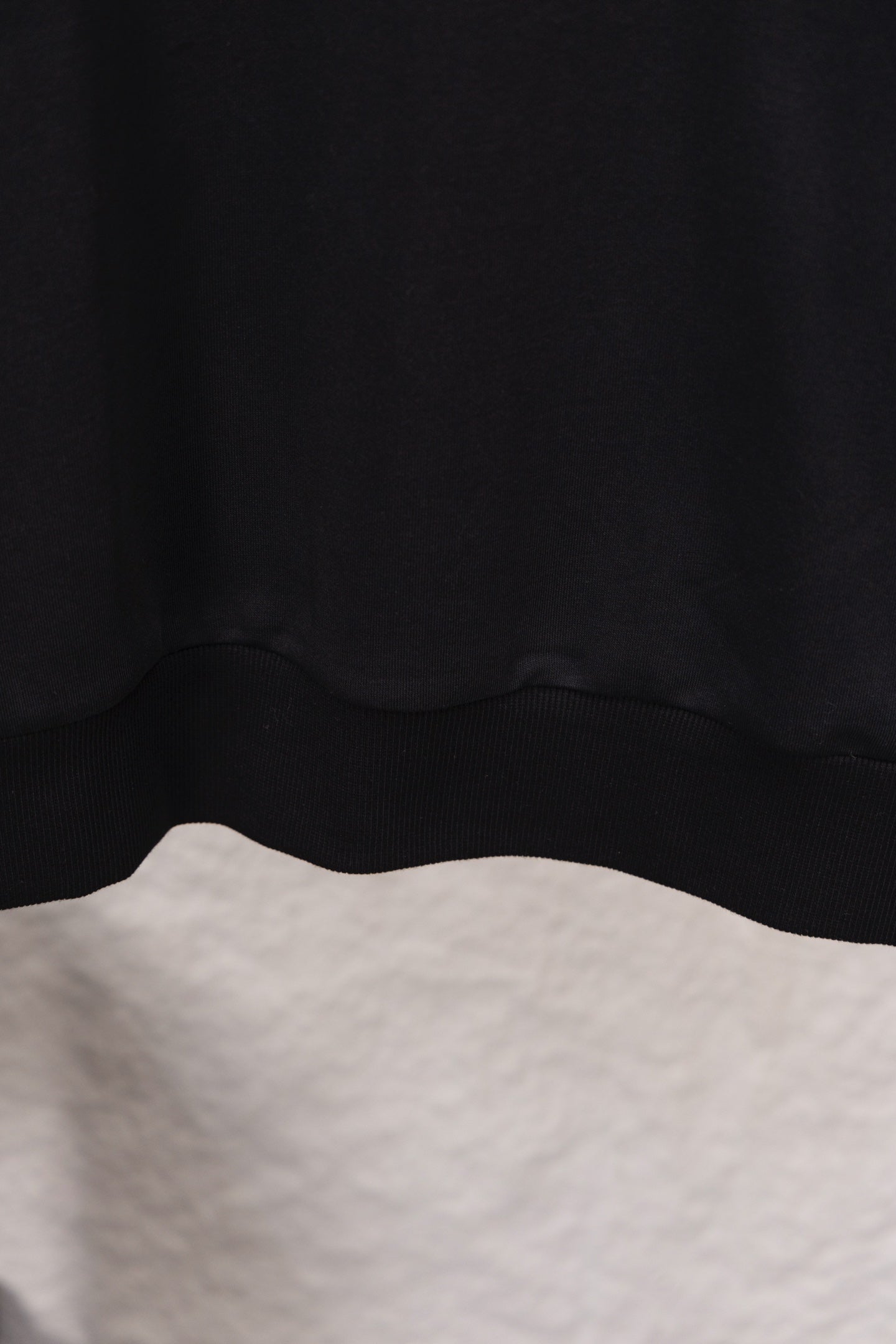 Prada sweatshirt hem with ribbed waistband, close-up