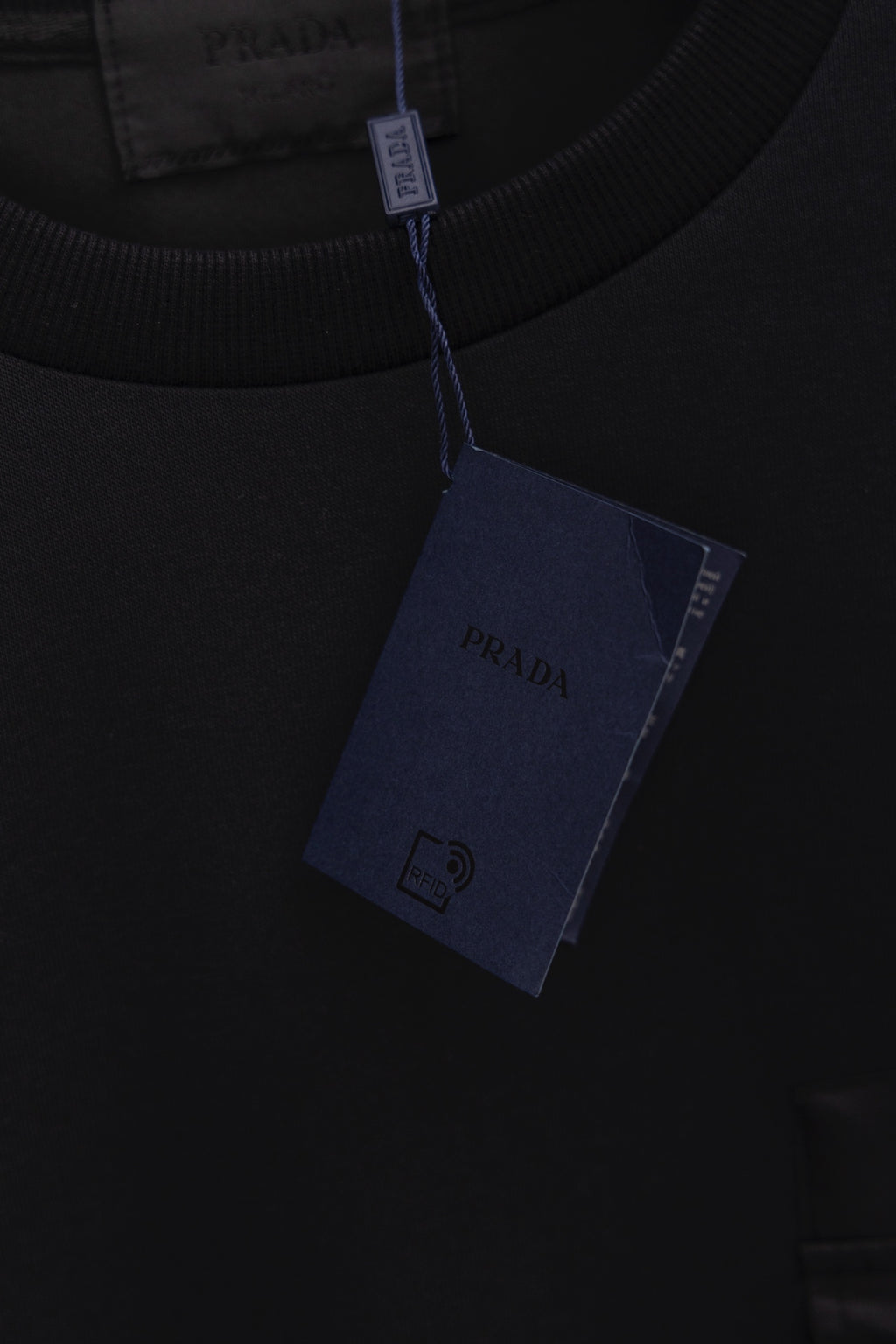 Prada crewneck sweatshirt neckline close-up with interior fabric tag
