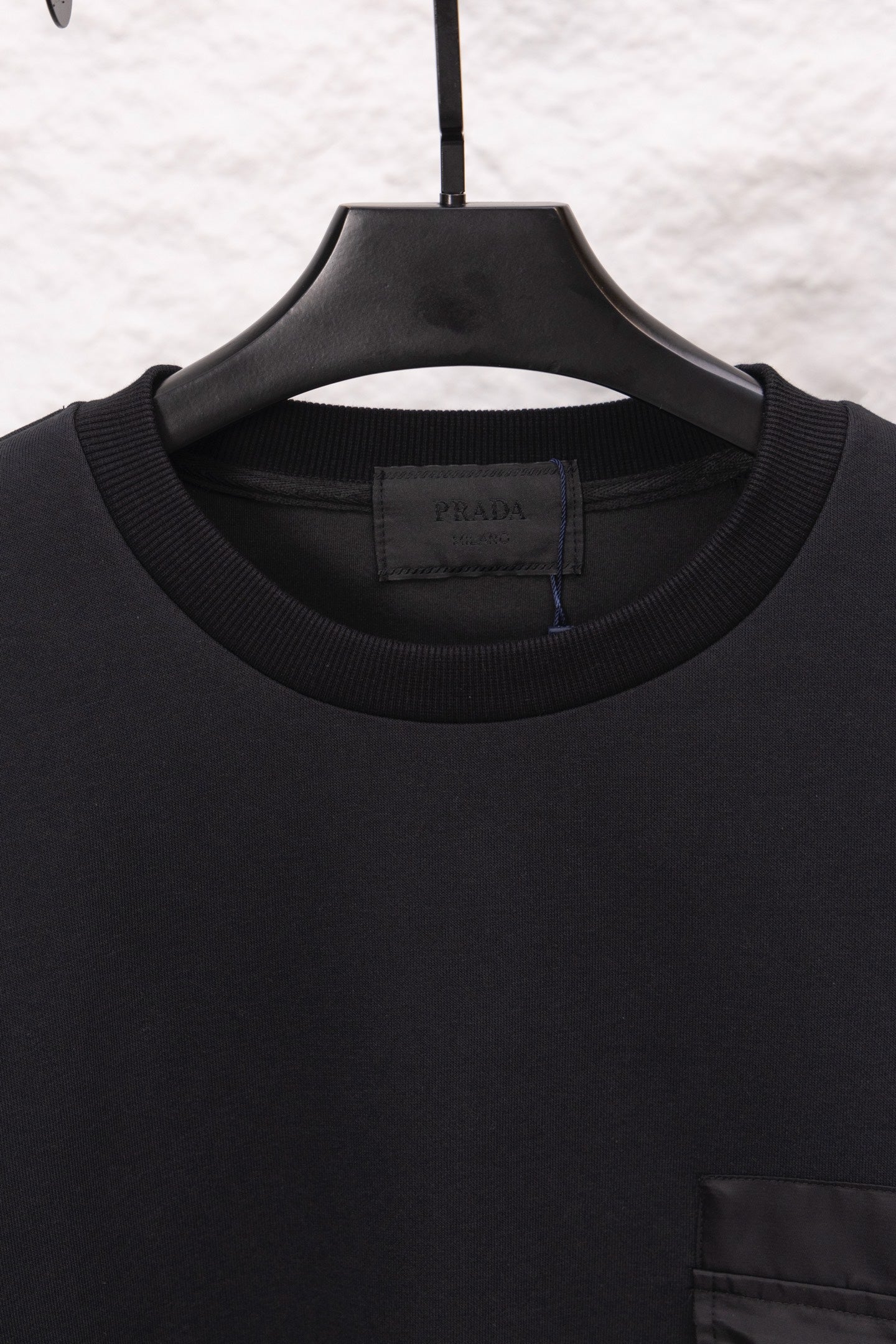 Prada crewneck sweatshirt collar and ribbed neckline detail, close-up