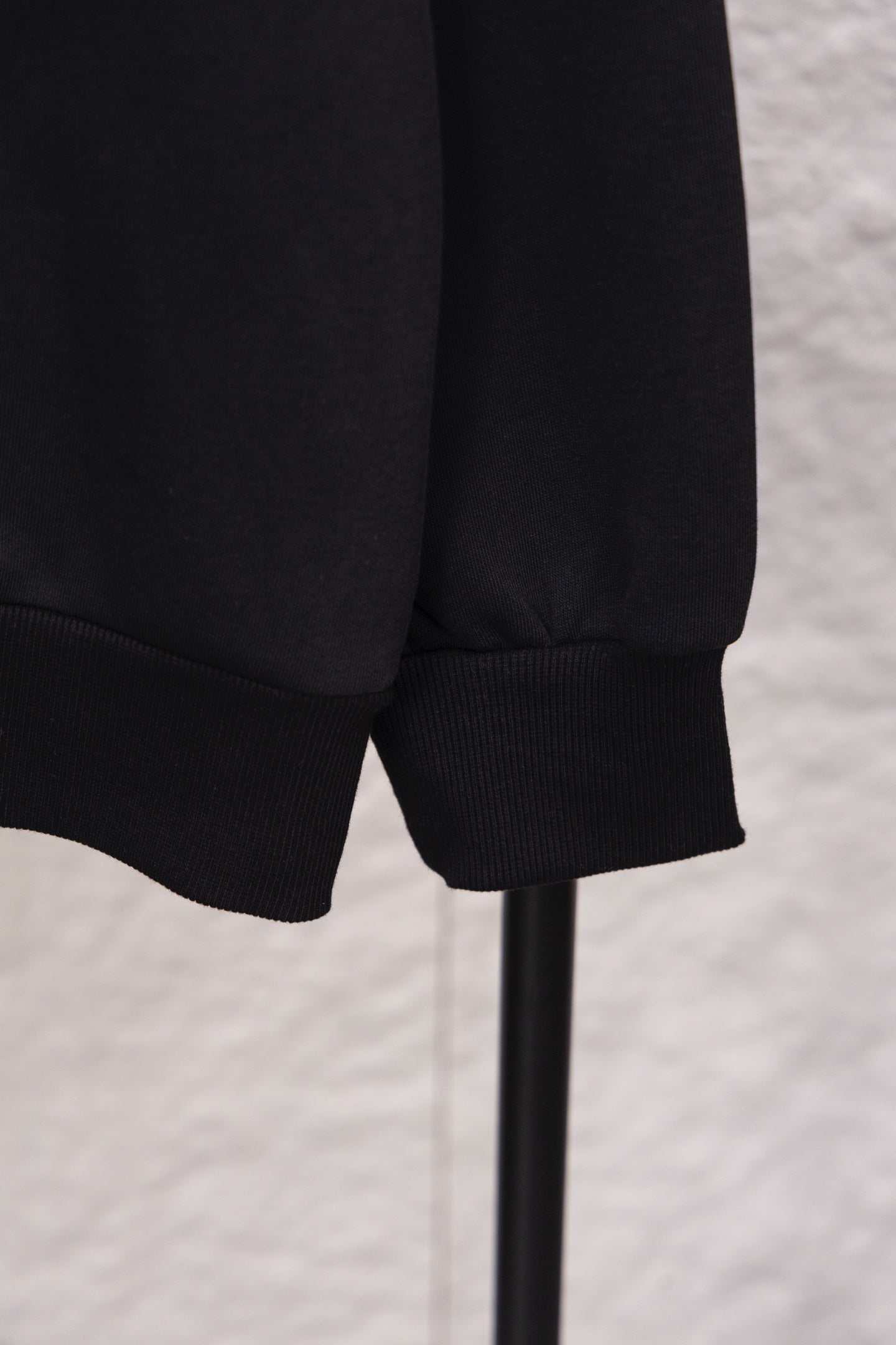 Prada sweatshirt lower hem and ribbed cuffs, close-up