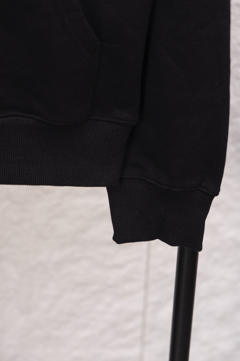 Prada sweatshirt sleeve cuff and ribbed hem, close-up