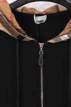 Black hoodie with plaid hood lining and metal front zipper pull