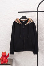 Black zip hoodie with plaid hood lining and front zipper