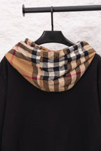 Black hoodie with plaid hood lining, front view