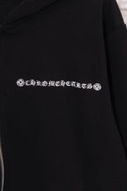 Black hoodie with embroidered logo text detail across the chest