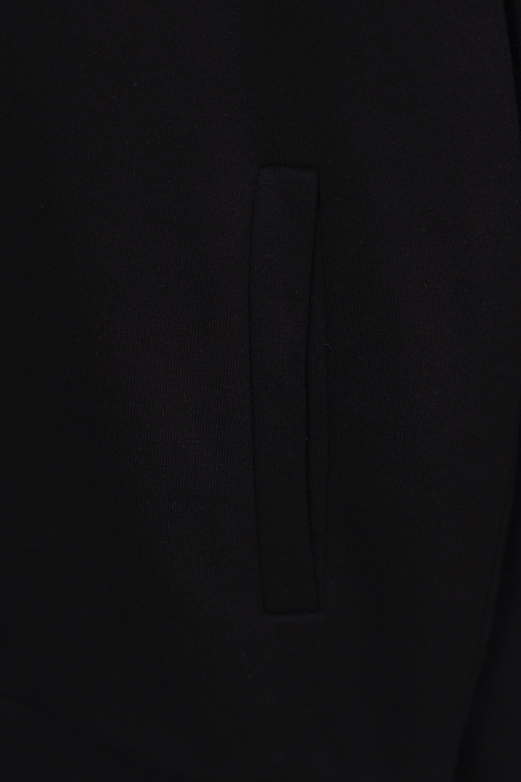 Black hoodie pocket with vertical seam detail on the front side