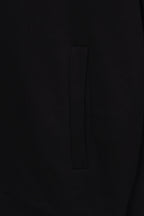 Black hoodie pocket with vertical seam detail on the front side
