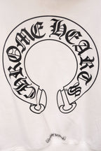 White hoodie with large circular emblem graphic printed on the front