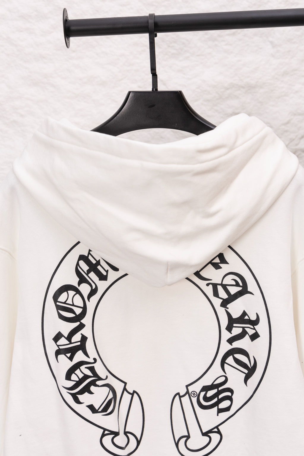 White zip-up hoodie back view with hood and large circular graphic