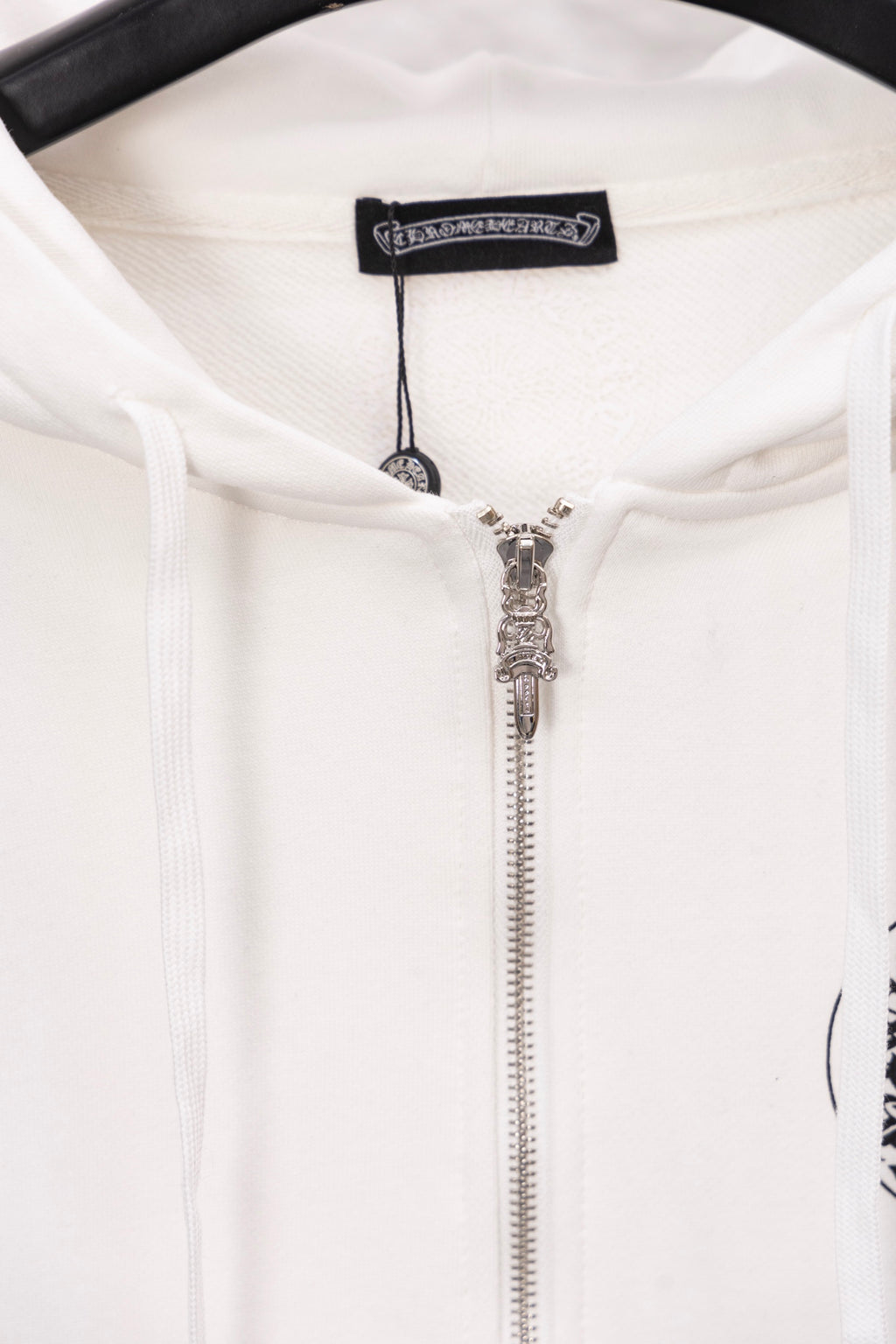 White long-sleeve zip hoodie with silver zipper and drawstring hood