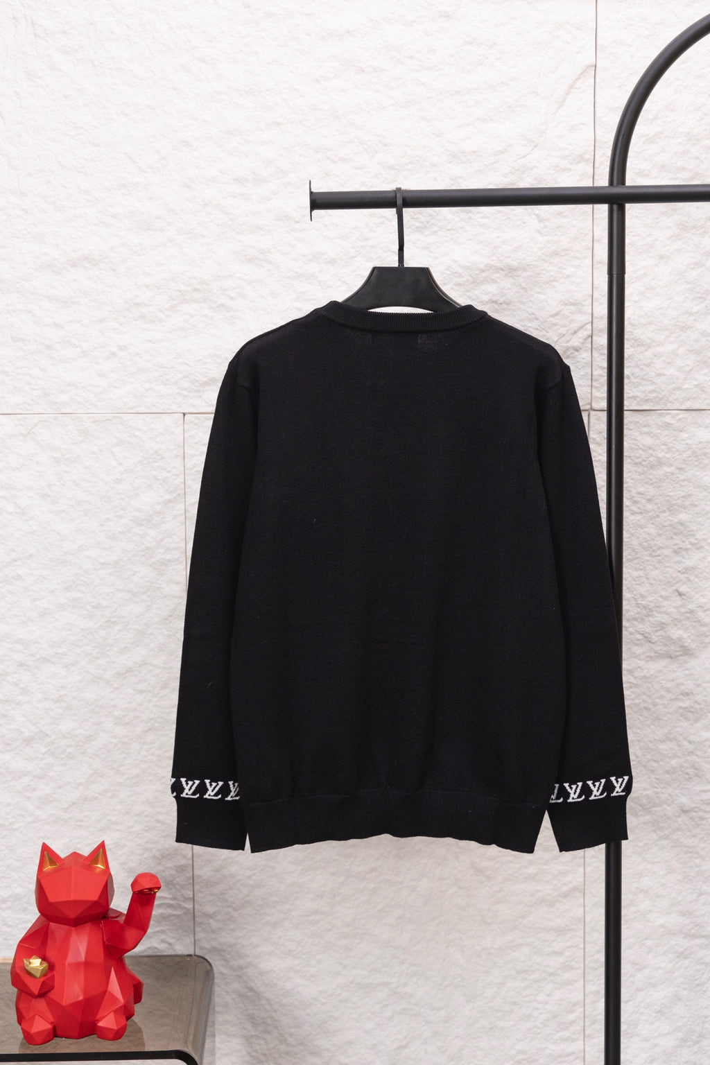 Black Louis Vuitton long-sleeve sweatshirt back, ribbed hem with repeating LV pattern