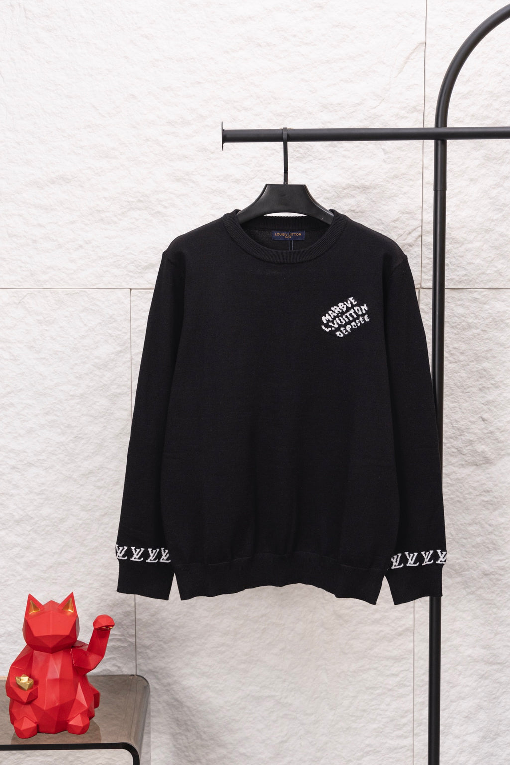 Black Louis Vuitton long-sleeve sweatshirt on hanger, chest logo print, ribbed cuffs