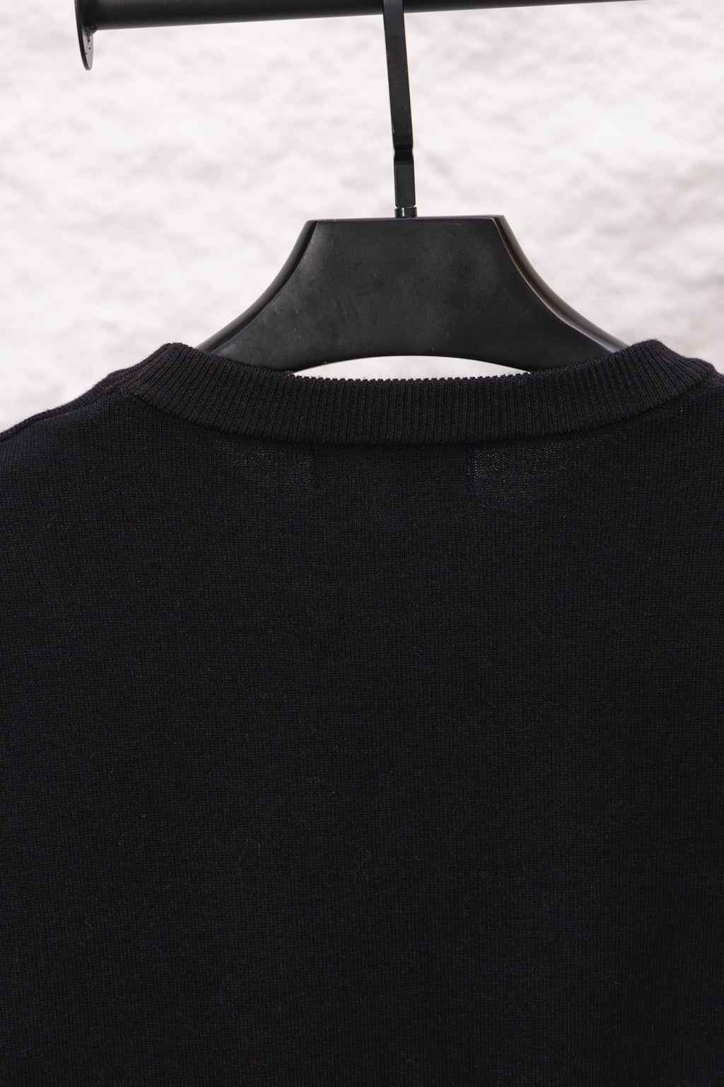Black long-sleeve sweatshirt ribbed crew collar, no visible front graphics