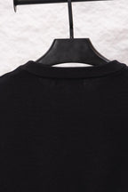 Black long-sleeve sweatshirt ribbed crew collar, no visible front graphics