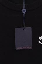 Black sweatshirt crew neck with hanging Louis Vuitton tag