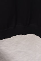 Black sweatshirt hem with ribbed lower band detail