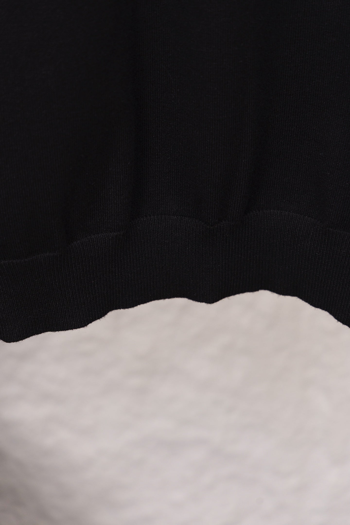 Black sweatshirt hem with ribbed lower band detail