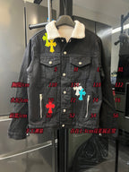 Black denim jacket with sherpa collar and multicolor cross patches, button front