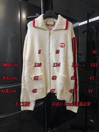 Gucci cream knit zip-up sweater on display with red side stripe and GG logo