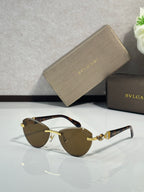 Bvlgari sunglasses with dark brown lenses, dark frame, and gold-tone temples