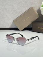 Bvlgari sunglasses with pink-tinted lenses, dark frame, and gold-tone accents