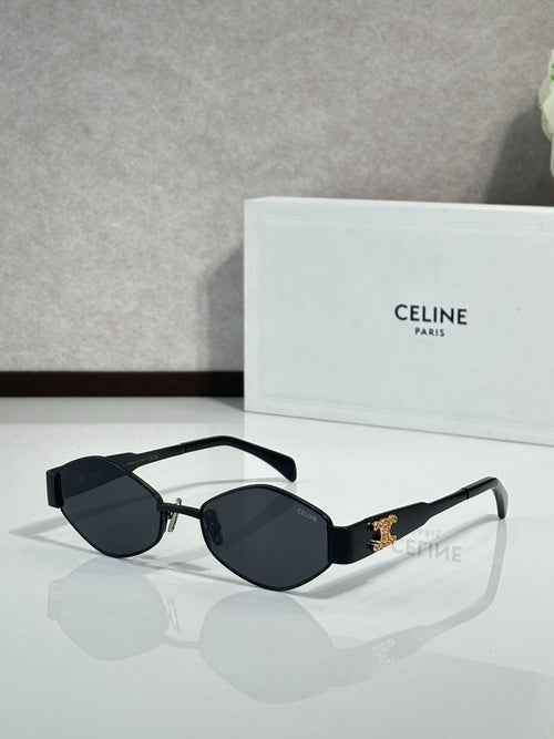 Black cat-eye sunglasses with dark lenses and gold-tone logo detail
