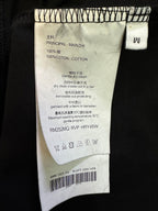 Black T-shirt care label with "100% coton" and washing instructions