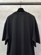 Black T-shirt back view with crew neckline and short sleeves