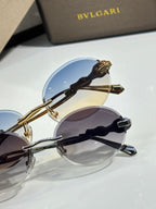 Bvlgari round sunglasses with gold frame and blue mirrored lenses