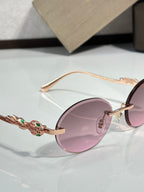 Bvlgari round sunglasses with pink lenses and rose-gold frame detail