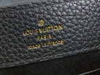 Louis Vuitton label on black textured leather: PARIS made in France
