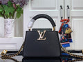Louis Vuitton black handbag with gold LV medallion and chain strap