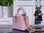 Louis Vuitton bag in light pink textured leather, gold LV hardware, chain strap